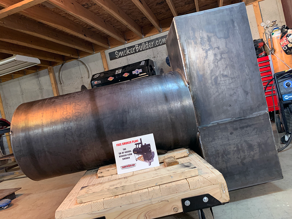 smoker being built with a set of plans in front of it