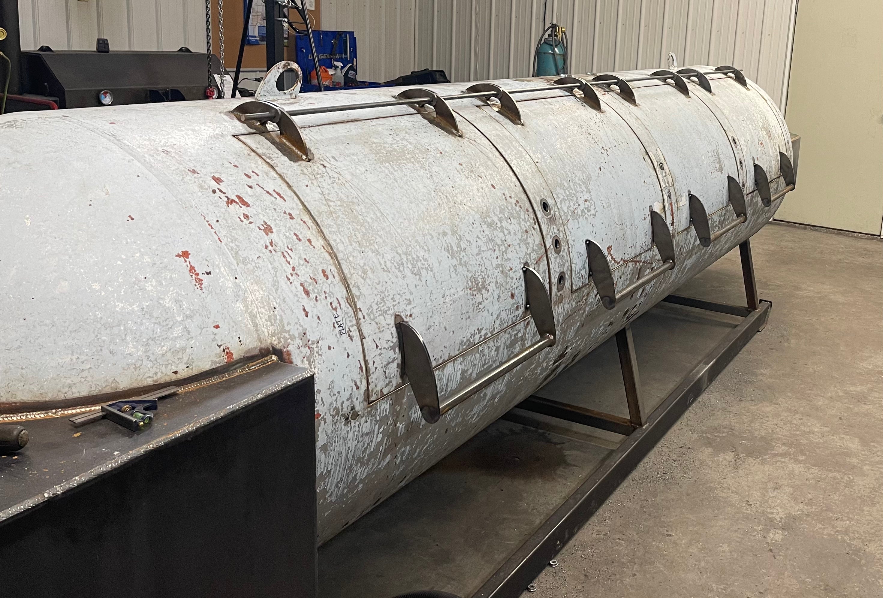 hinges and handles installed on a smoker in progress of being built